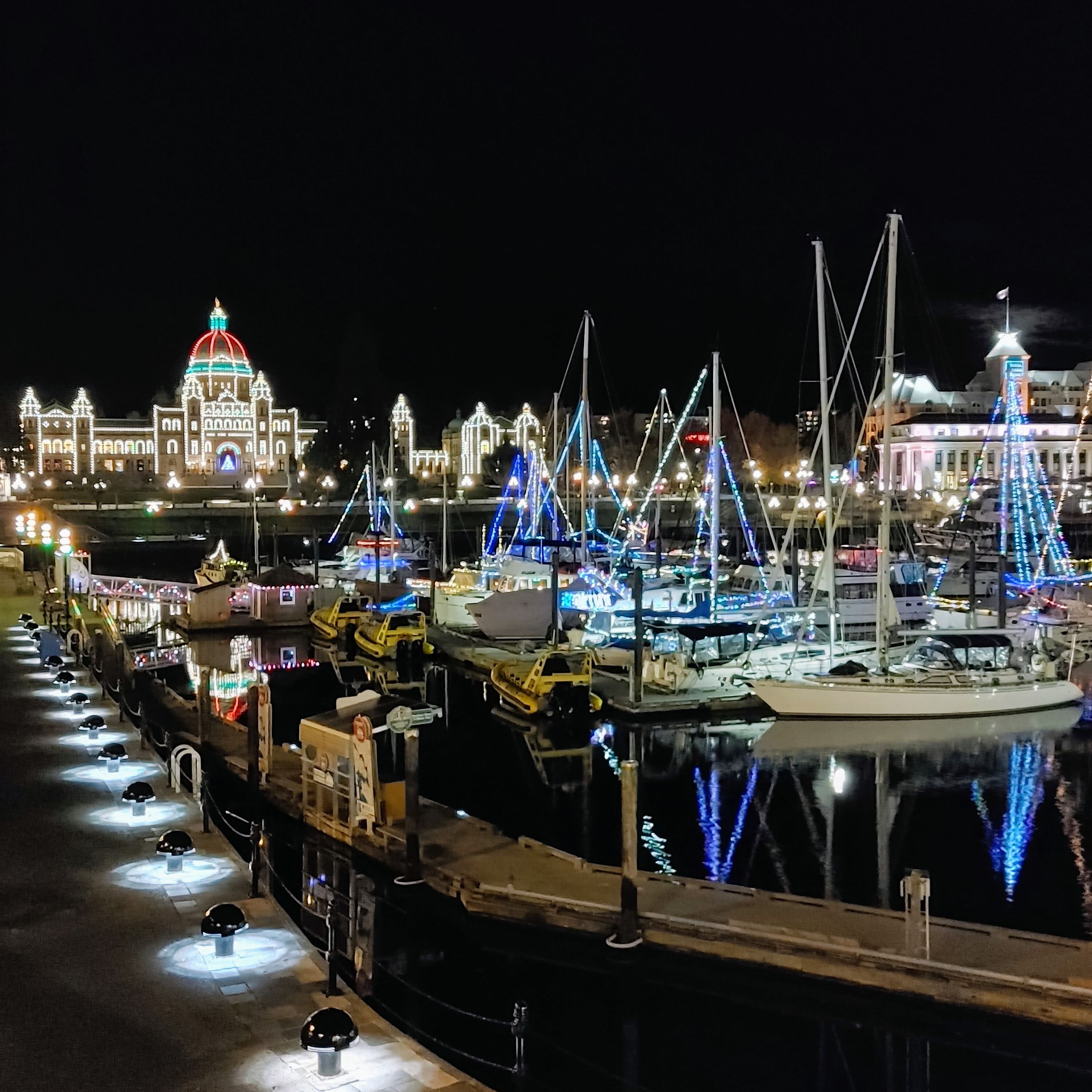 Victoria, BC harbour at night with Christmas light decorations
